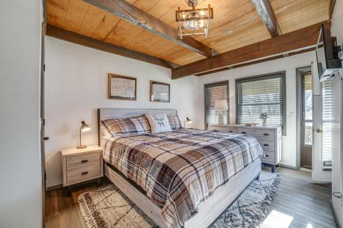 a bedroom with a bed and a wooden ceiling at Chic Greek Peak Ski Resort Townhome with Balconies in Cortland