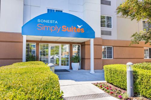 a sign for a synergy synergy simply suites building at Sonesta Simply Suites Denver West Federal Center in Lakewood