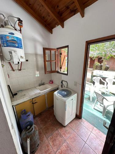 a bathroom with a washing machine and a sink at OKIN 2 in Costa del Este