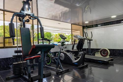a gym with several tread machines in a room at Hotel del Llano in Villavicencio