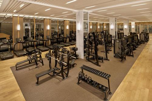 a gym with many rows of treadmills and machines at JW Marriott Dongdaemun Square Seoul in Seoul