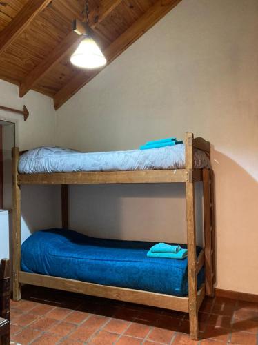 two bunk beds in the corner of a room at Casa Nelly 2 in Playa Unión