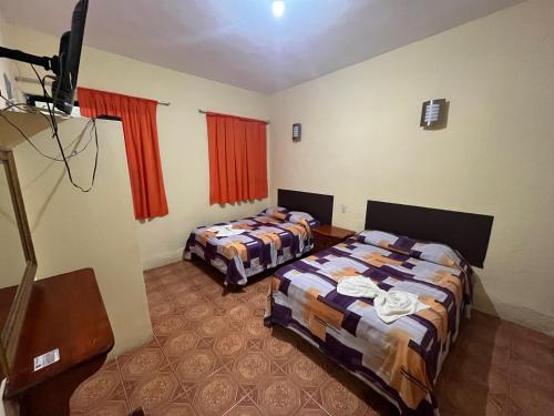 Ένα ή περισσότερα κρεβάτια σε δωμάτιο στο Hotel Puerto Real-Minatitlán