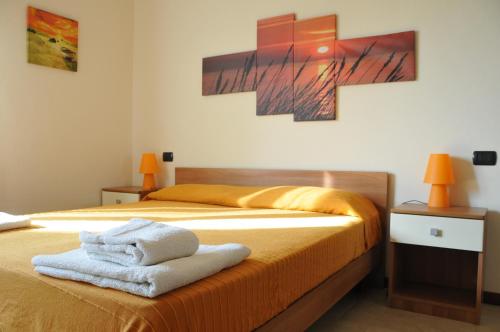 Ένα ή περισσότερα κρεβάτια σε δωμάτιο στο Appartamento Lago