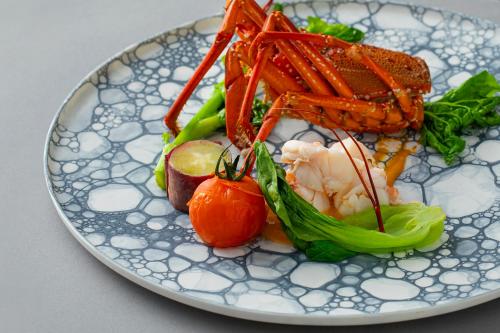 a plate of food with shrimp and vegetables on it at Fugaku Gunjo in Izu