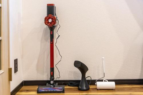 a red and black machine on a wooden table at Ocean Niponichi in Osaka
