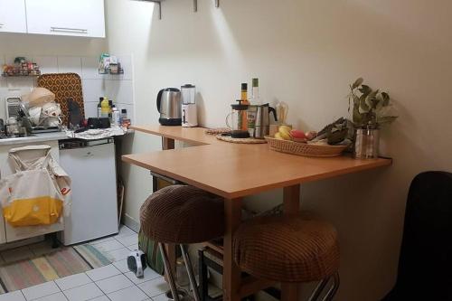 Kuchyňa alebo kuchynka v ubytovaní Les Lilas : Joli Studio cosy