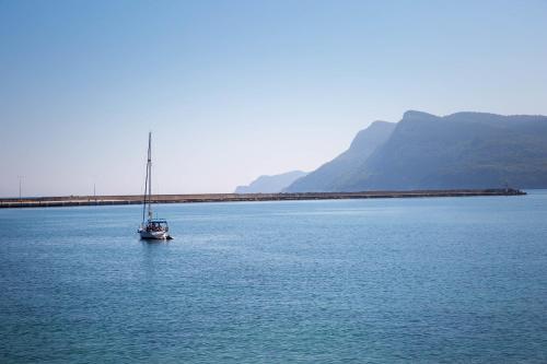 a sailboat in the middle of a large body of water at Northdoor Hotel in Amasra