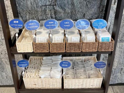 a display of diapers in baskets on a shelf at Hearton Hotel Shinsaibashi Nagahoridouri in Osaka