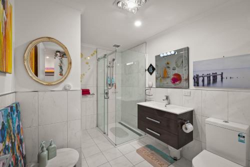 a bathroom with a shower and a toilet and a sink at Nelson Apartment - 2 Bedroom 2 Bathroom in Sandy Bay