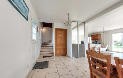 a hallway with a dining room and a kitchen at Stunning Home In St Paer With Wifi in Saint-Pierre-de-Varengeville