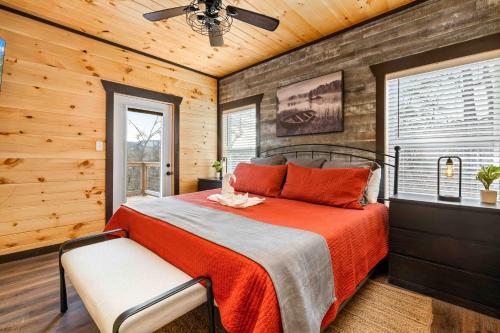 a bedroom with a bed and a ceiling fan at Hidden Gem Masterpiece By Ghosal Luxury Lodging in Gatlinburg