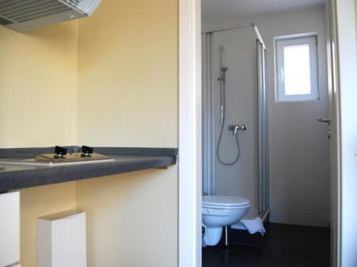 a bathroom with a sink and a toilet at Ferienwohnung Hiddensee in Vitte in Vitte