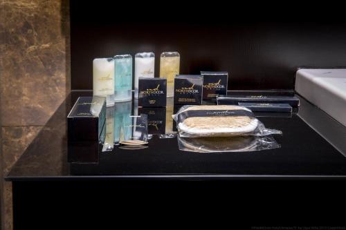 a table with a cake and candles on it at Northdoor Hotel in Amasra
