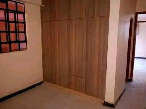 an empty room with a wooden wall and a door at Safaris hotels in Nairobi