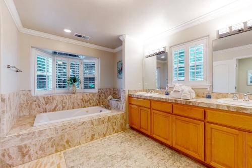 a large bathroom with two sinks and a tub at Coastal Bliss in Half Moon Bay