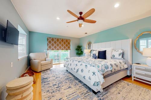 a bedroom with a bed and a ceiling fan at Coastal Bliss in Half Moon Bay
