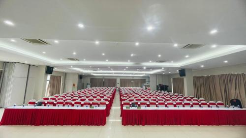 a large room with red tables and chairs at PSA Nghi Sơn Condotel in Thanh Hóa