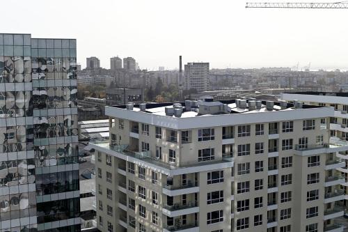 an aerial view of a white building and a city at The Swing in Burgas City