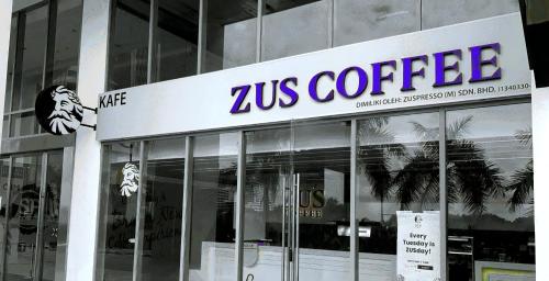 a zeus coffee sign on the side of a building at Attic Home Melaka Silverscape Residence & Jonker in Melaka