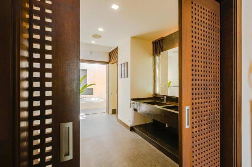 a bathroom with a sink and a mirror at 7 Bedrooms Mansion on The Golf Course! JB2 in Hua Hin