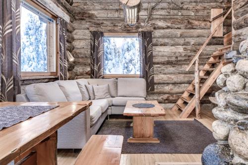 a living room with a couch and a table at Ruka Inn in Ruka