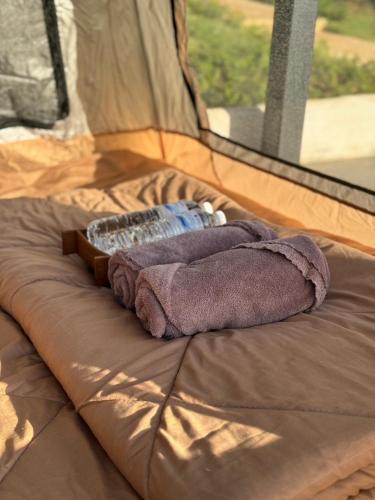 a blanket on a bed in a tent at Pai Chao Kha in Pai