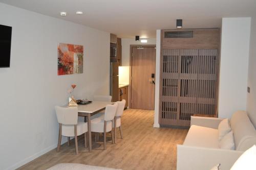 a dining room and living room with a table and chairs at 507 Athens in Athens