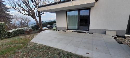 a patio outside of a house with a window at Studio / Ferienwohnung Bamlach in Bad Bellingen