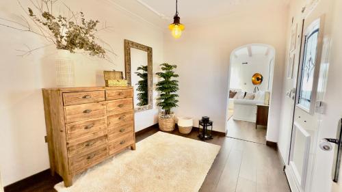 a room with a dresser and a mirror at Exclusive Villa Valencia - Denia Els Poblets in Els Poblets