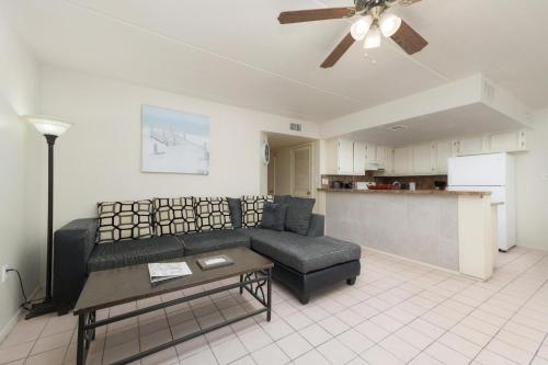 a living room with a couch and a table at Lovely 2 Bed 2 Bath 2nd Floor Condo By Beach in South Padre Island