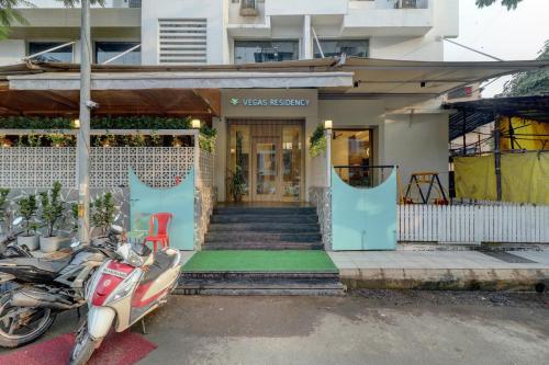 a scooter parked in front of a building at VEGAS RESIDENCY in Kalyan