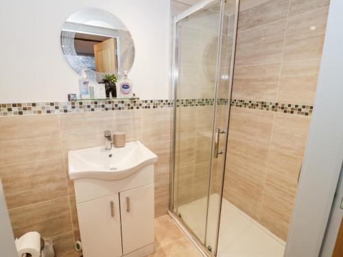 a bathroom with a shower and a sink at The Fox in Bridgnorth