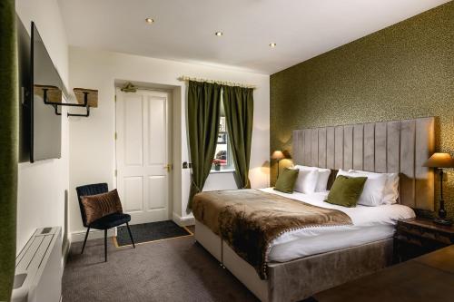 a hotel room with a bed and a window at The Borough Lancaster in Lancaster