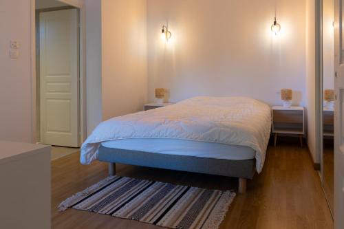 Postel nebo postele na pokoji v ubytování L'Orangeraie de Portigliolo - Vue mer 4 chambres