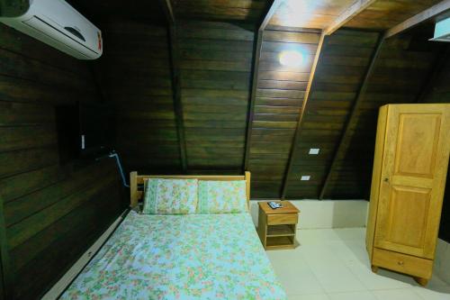 מיטה או מיטות בחדר ב-Pousada Ecologica Bangalo de Praia