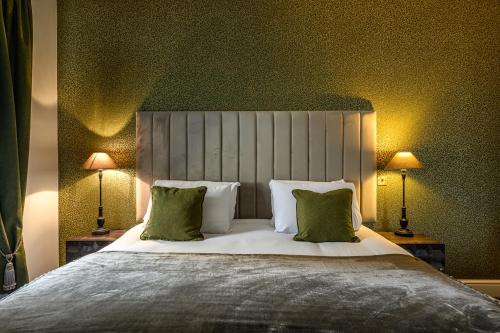 a bedroom with a large bed with two lamps at The Borough Lancaster in Lancaster
