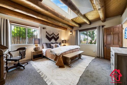 a bedroom with a bed and a window at Rancho de La Luna Casita in Santa Fe
