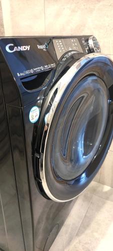 a washing machine is on display in a store at Apartament nad Jeziorem w Olecku in Olecko