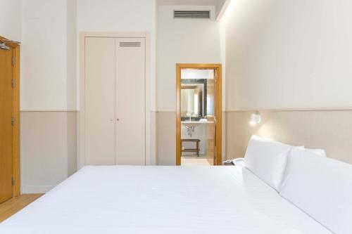 Кровать или кровати в номере Hotel Terrassa Confort