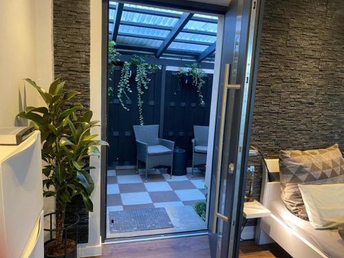 a glass door leading to a patio with chairs at Apartment 1 in Neuruppin