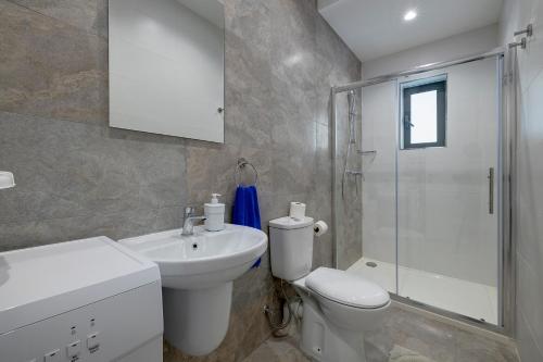 a bathroom with a toilet and a sink and a shower at Sliema 2BR Great Location with Terrace in Sliema