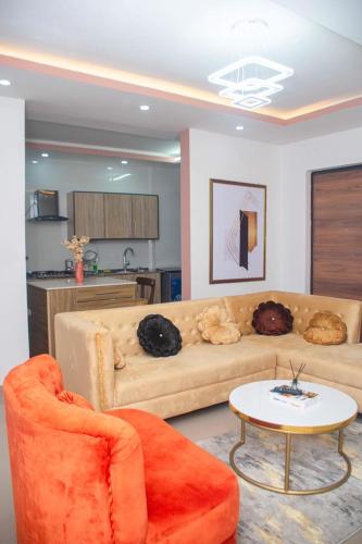 a living room with a couch and a table at willy's apartment in Lagos