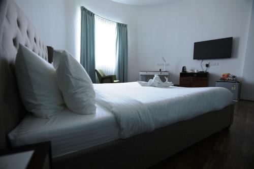 Postel nebo postele na pokoji v ubytování Highway Star