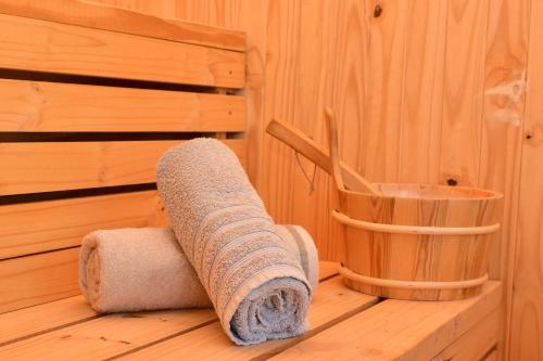 a roll of towels sitting in a sauna at Villa Palesa Guesthouse in Grahamstown