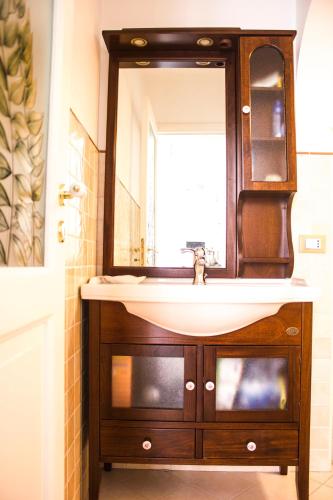 a bathroom with a sink and a mirror at Dimora Iride in Monopoli