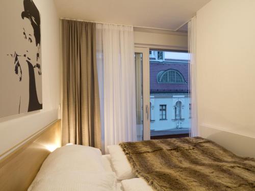 Postel nebo postele na pokoji v ubytování Balcony Dream Mariahilf Top 29
