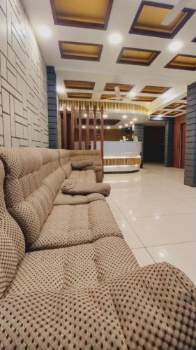a row of pillows sitting in a room at Hotel Royal Wings in Elūr