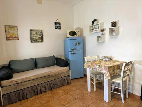 a living room with a couch and a table at La casa di Maya in Sassari