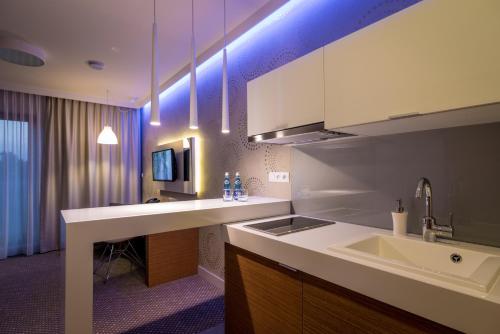 a kitchen with a sink and a counter top at Rest Apartments in Wrocław